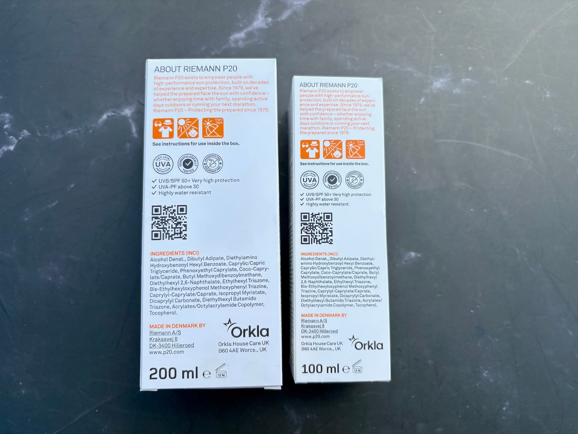 Bagside af kasser med P20 Riemann Original Spray SPF 50+