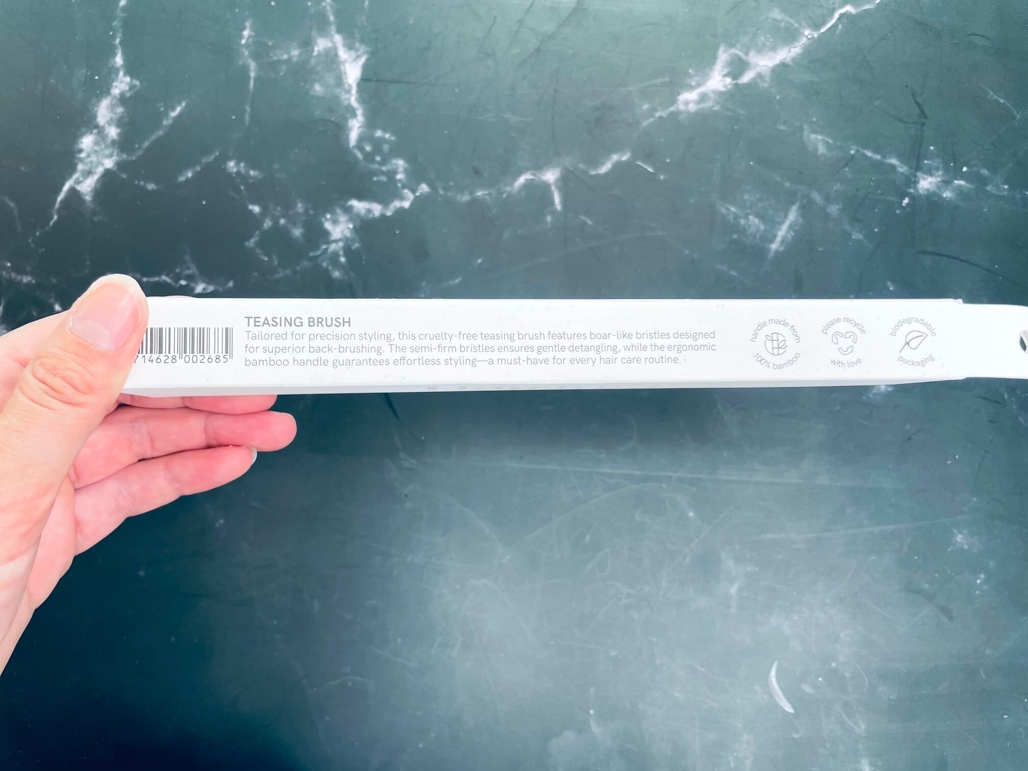 Bagside af Teasing brush kasse fra Hairlust