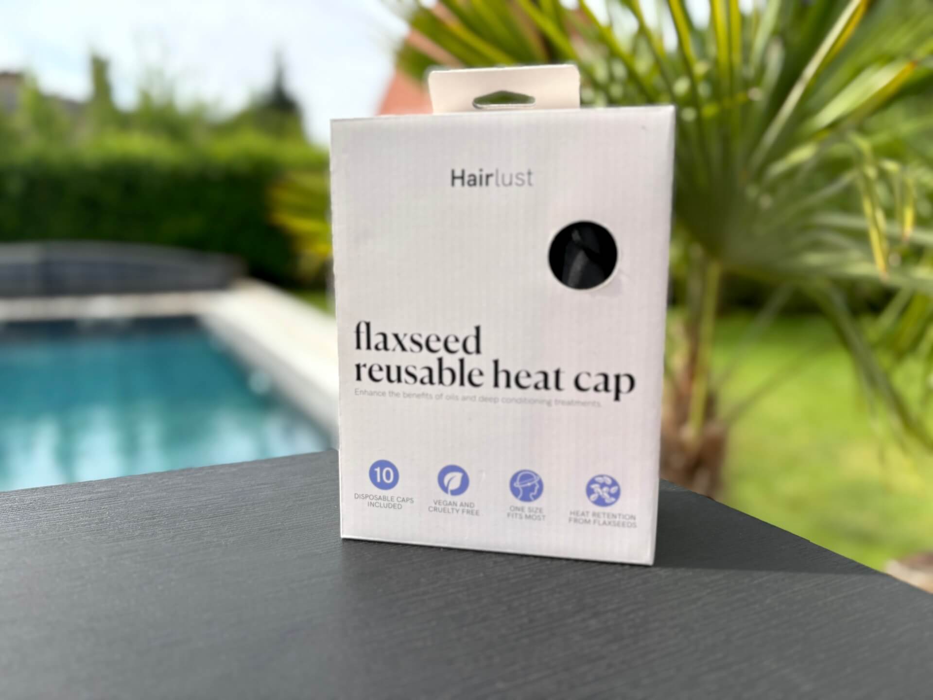 Hairlust Flaxseed Reusable Heat Cap i kasse på bord