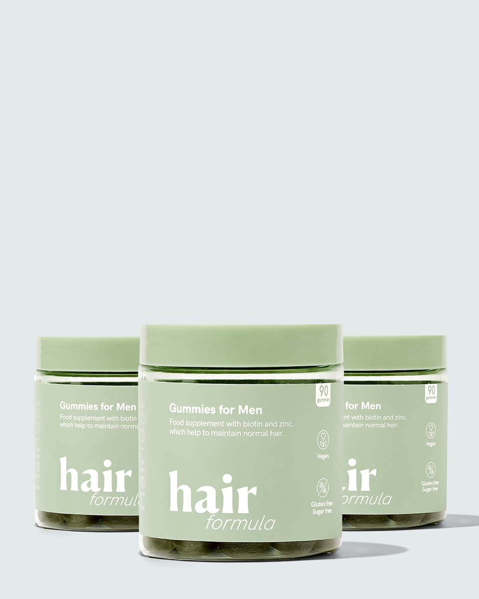 Hairlust Hair Formula Gummies til mænd med tre bøtter ved siden af hinanden