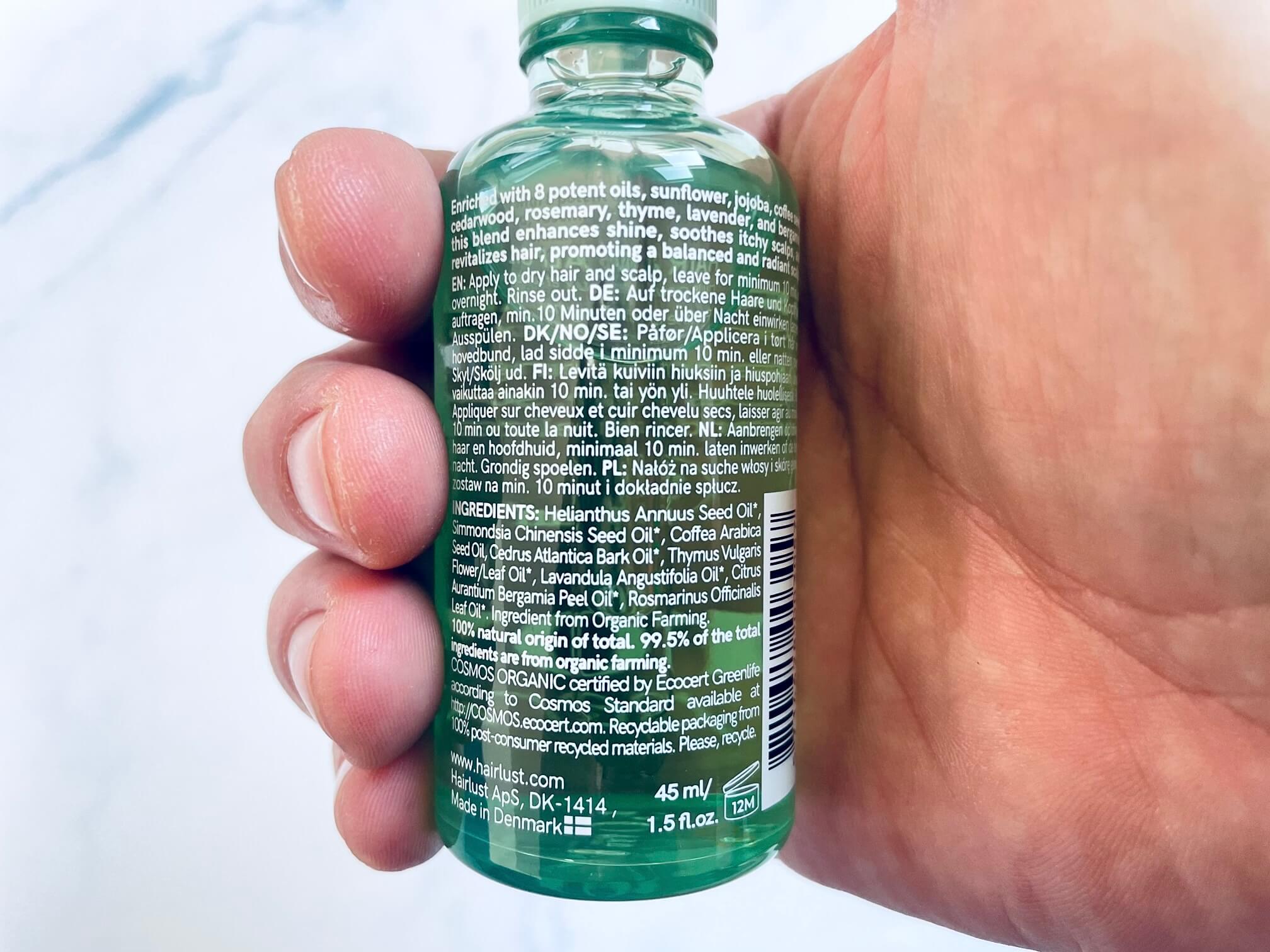 Ingredienserne på bagsiden af grow perfect hovedbundsolie fra Hairlust
