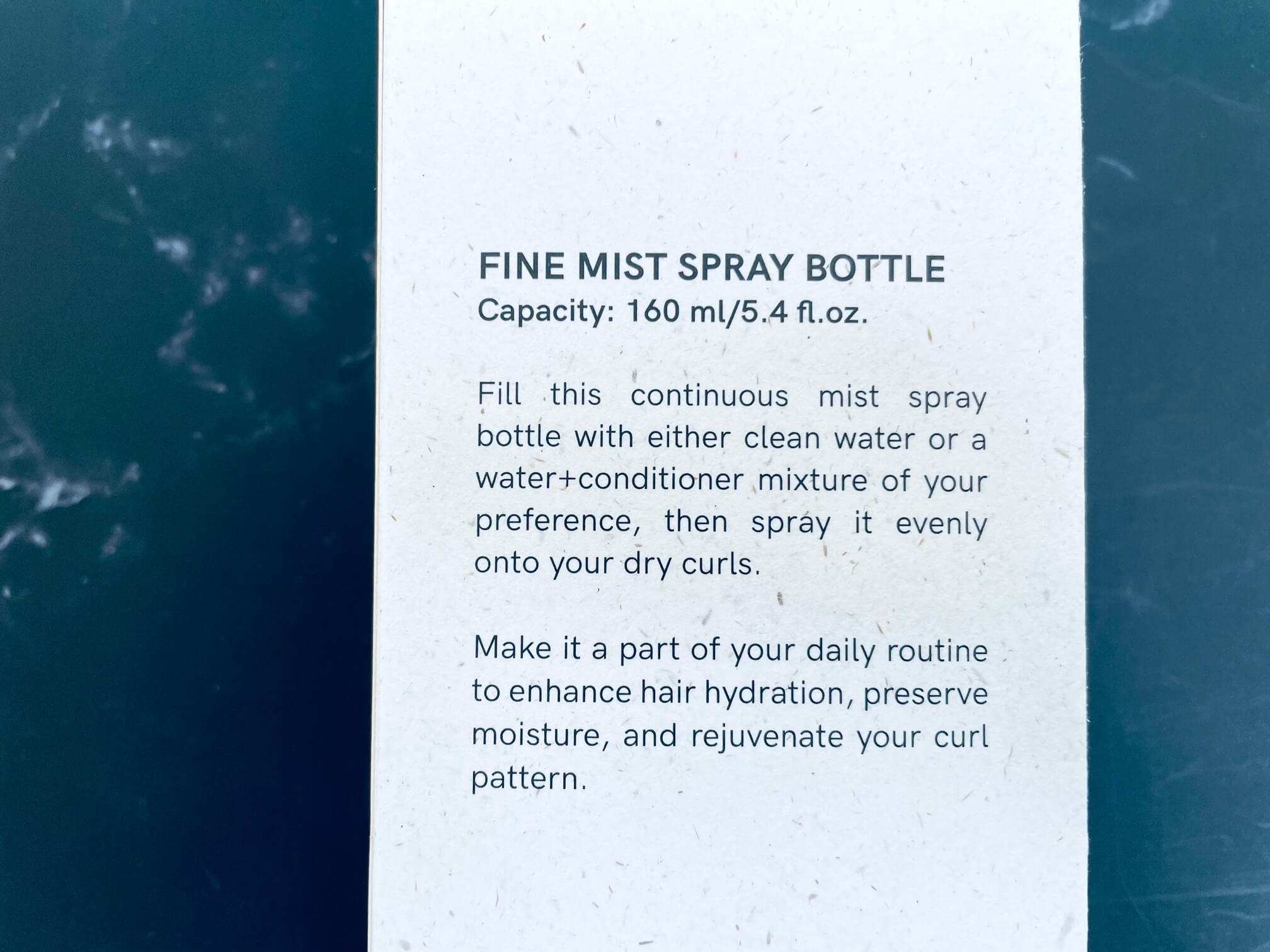 Siden af kasse på spray bottle