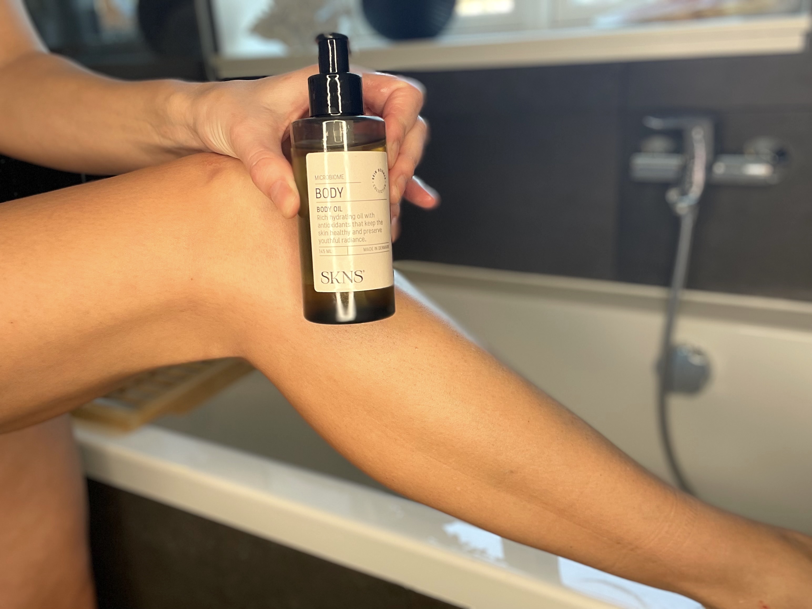 SKNS body oil foran ben