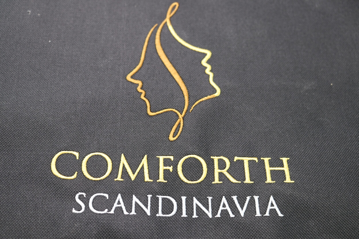 Vævet Comforth Scandinavia logo i varmtæppe
